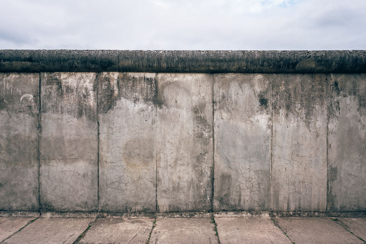Close-up of wall against sky