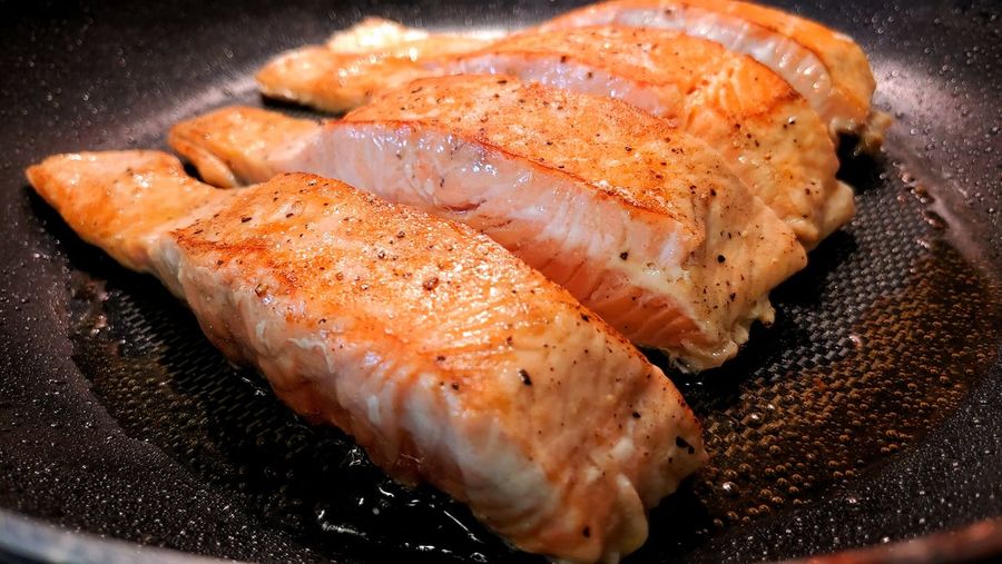 Close-up of salmon in cooking pan