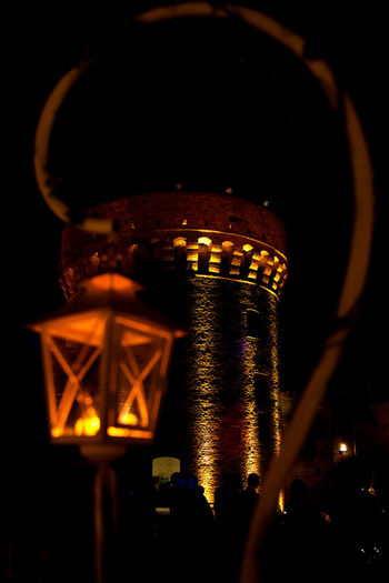 Low angle view of illuminated built structure at night