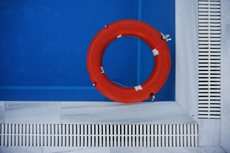Directly above shot of life belt floating on swimming pool
