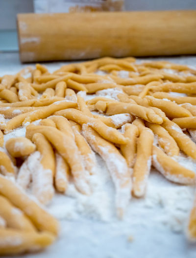 High angle view of dough with flour on table