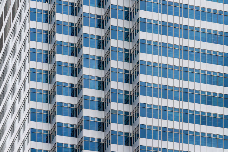 Low angle view of modern building against sky in city
