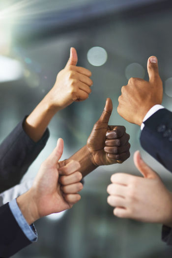 Cropped image of man holding hands