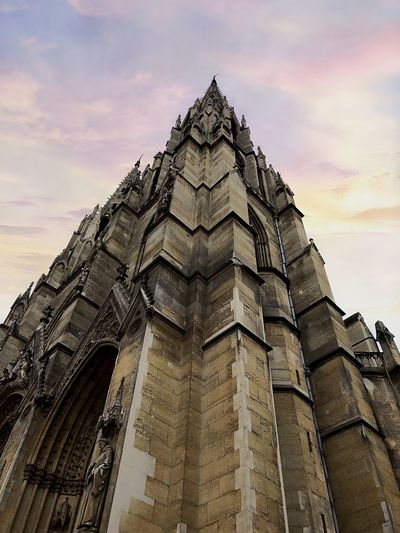 Low angle view of building against sky during sunset