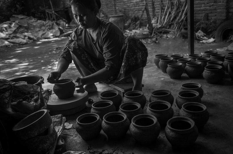 Female potter making pots