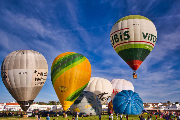 Multi colored hot air balloons against sky