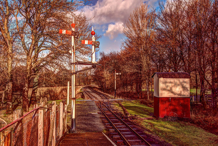 Railroad tracks against sky during autumn