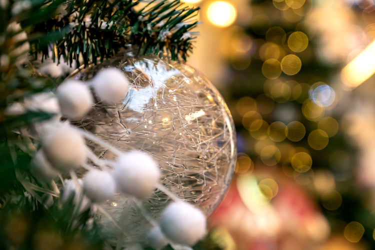 Christmas and new year holidays background. christmas tree decorated with white trnsparent ball. 