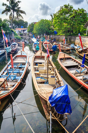 View of boats moored in canal