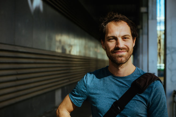 Portrait of young man standing outdoors