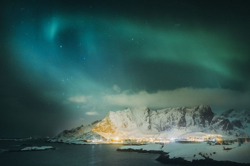 Panoramic view of sea against sky at night