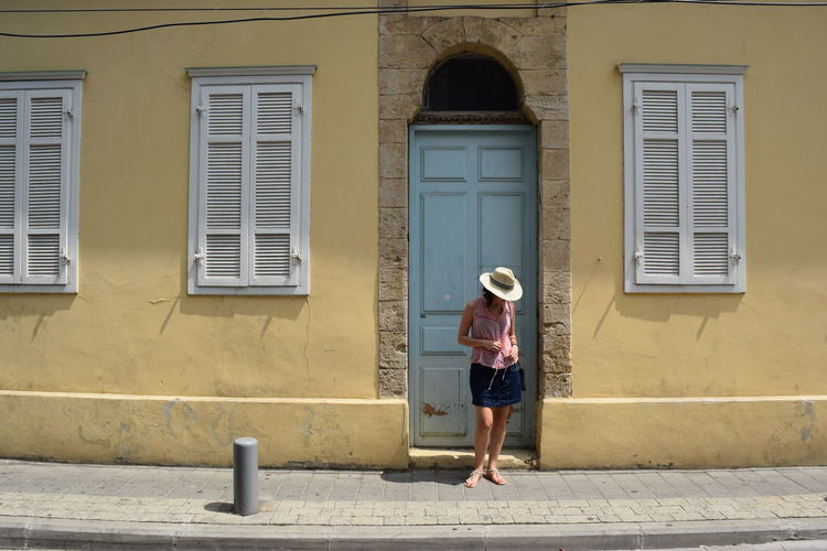 Woman standing in front of closed door