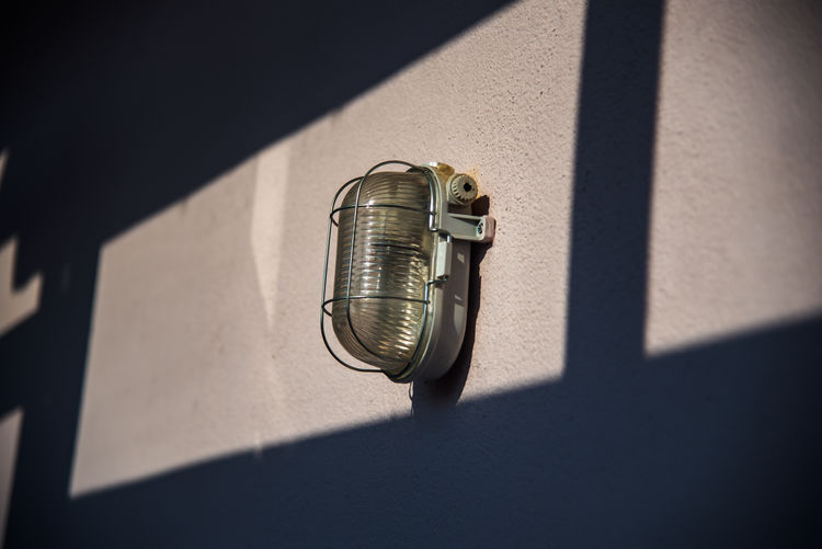 High angle view of electric lamp on wall