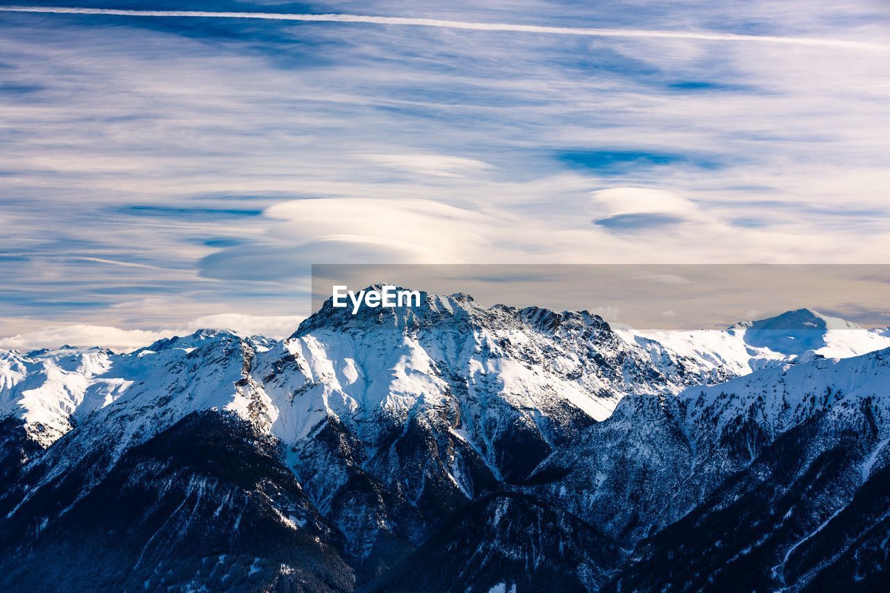 Scenic view of snowcapped mountains against sky 