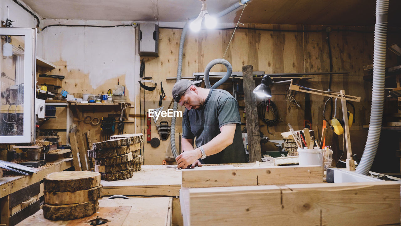 Carpenter working in factory