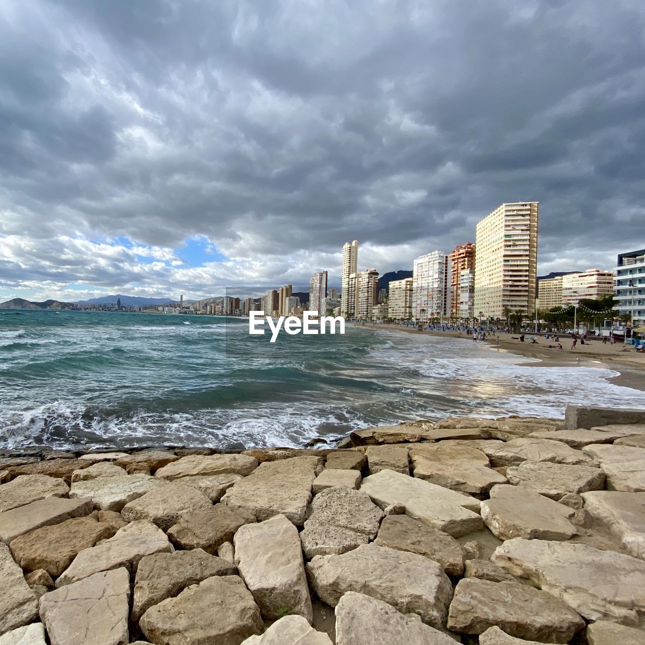 SEA AND BUILDINGS AGAINST SKY