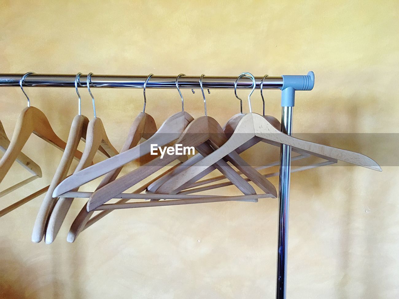 Empty Clothes Hanger Hanging On Metal Pole Id 93057276