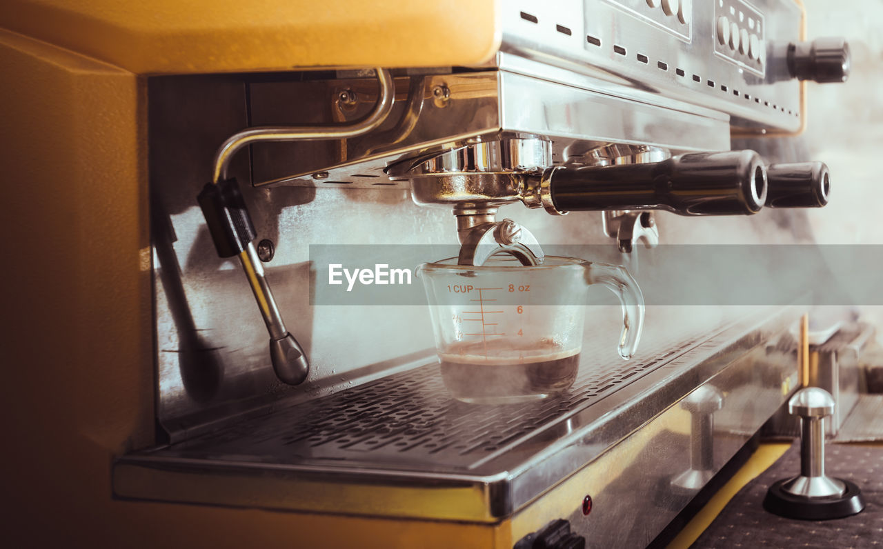 CLOSE-UP OF COFFEE SERVED IN KITCHEN