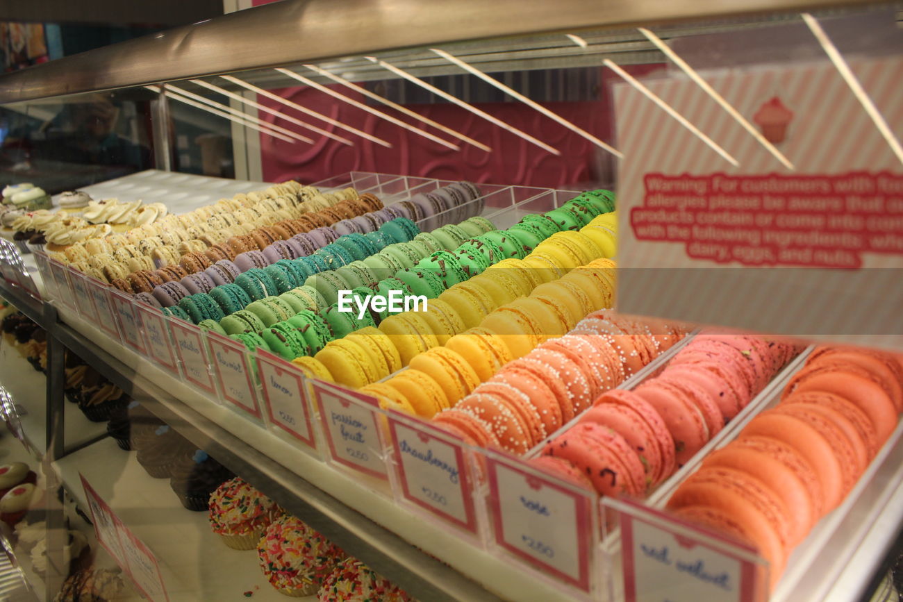 Colorful Macaroons In Display Cabinets For Id 90033921