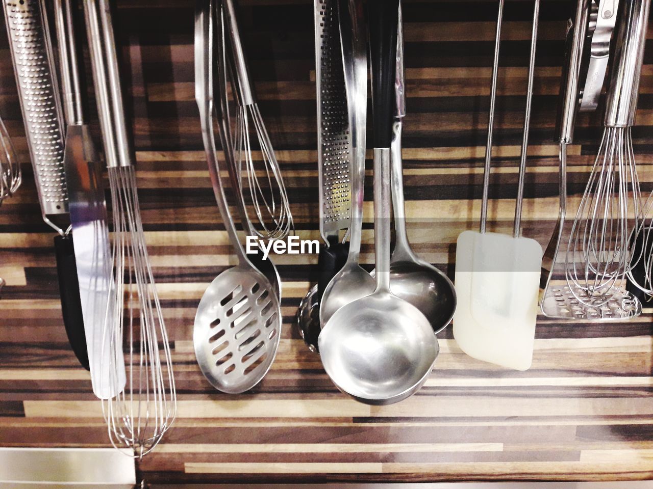Close Up Of Kitchen Utensils Hanging On Wall On Eyeem