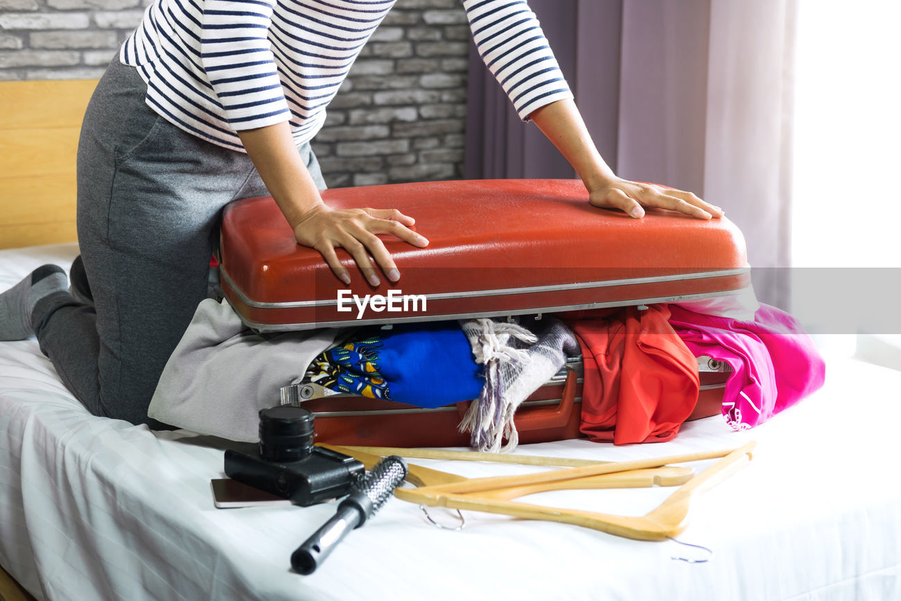 woman packing suitcase