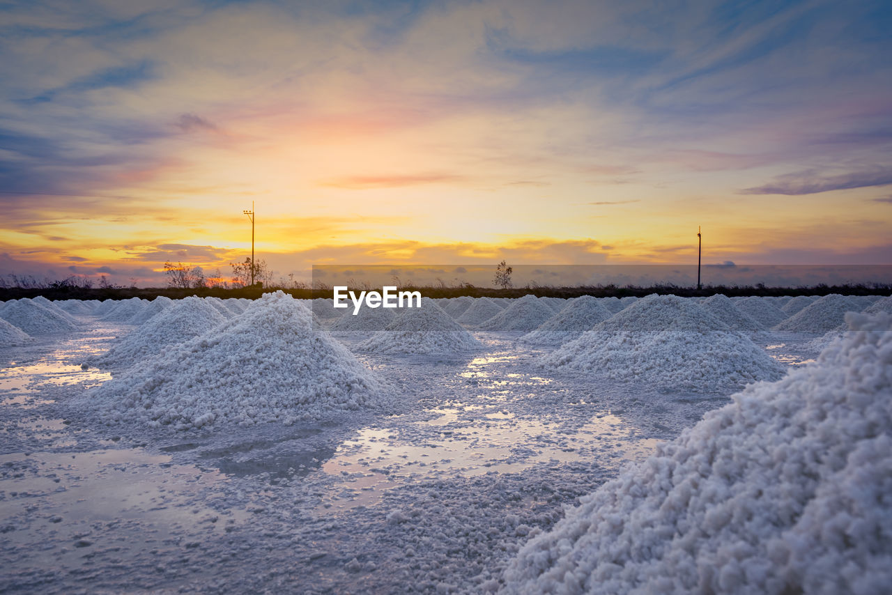 Salt farm in the morning with sunrise sky. organic sea salt. brine salt.