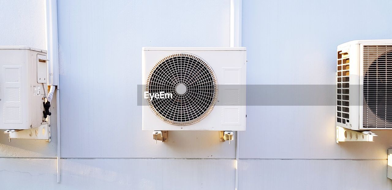 Directly below shot of electric fan on wall