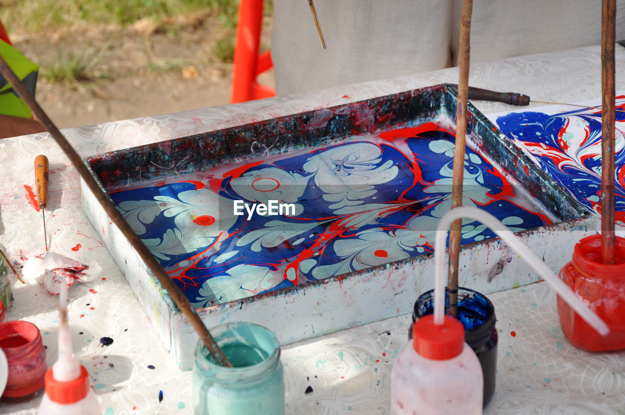 High angle view of painting equipment on table