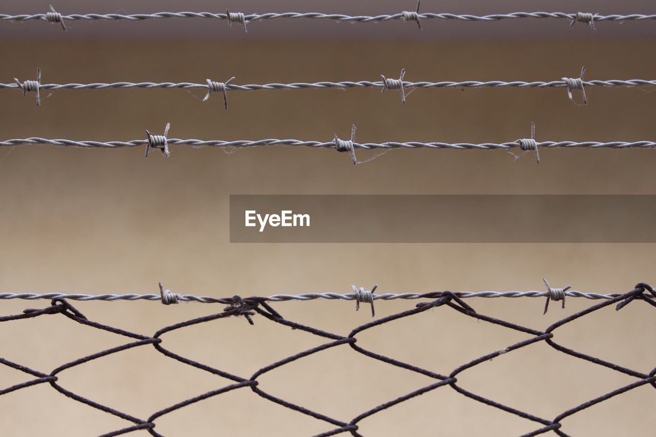 Close-up of barbed wire fence
