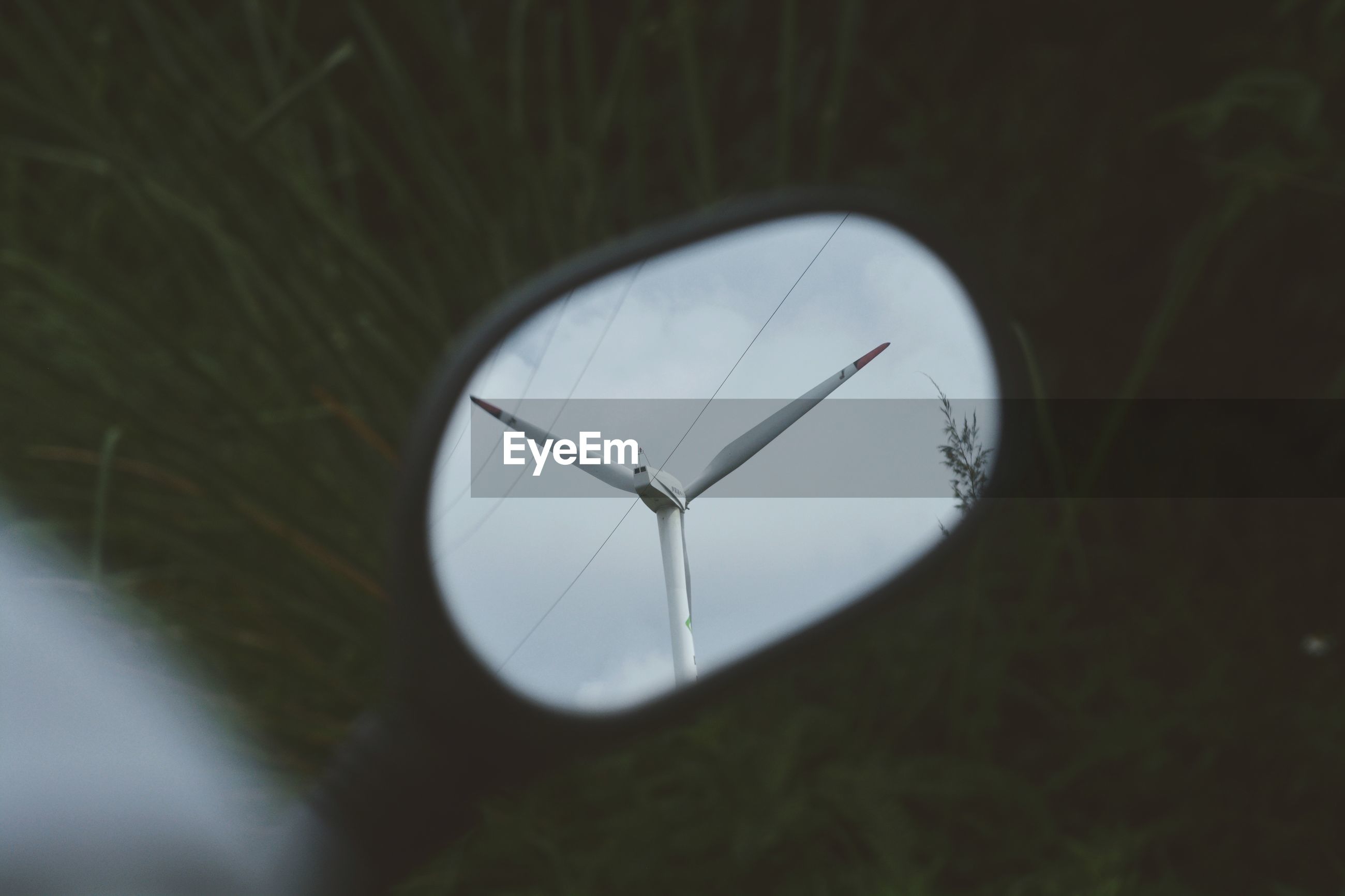 Wind turbines reflection on side view mirror  ID 127059734