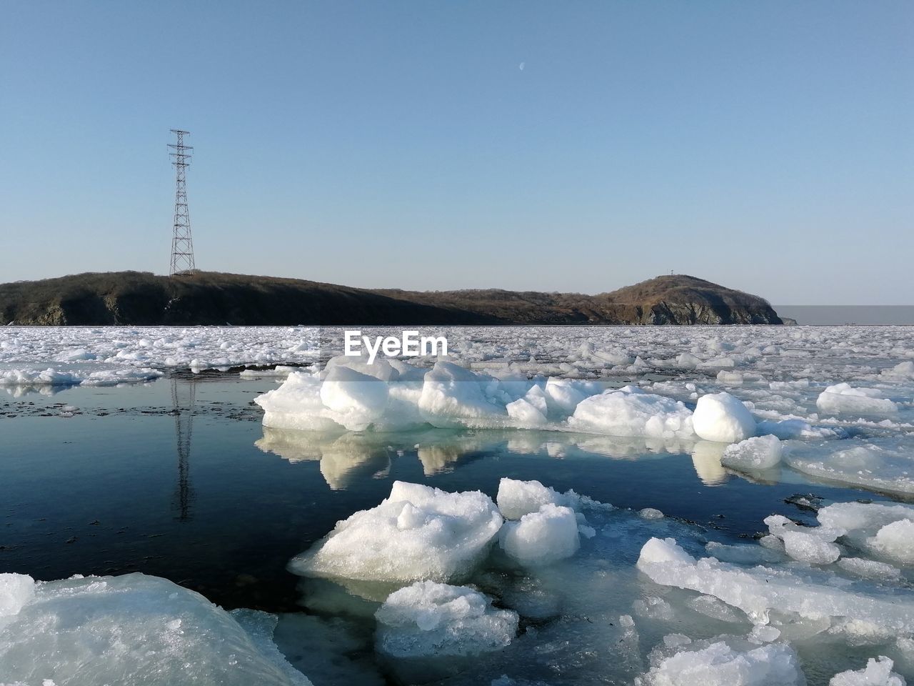 Frozen sea of japan against sky during winter