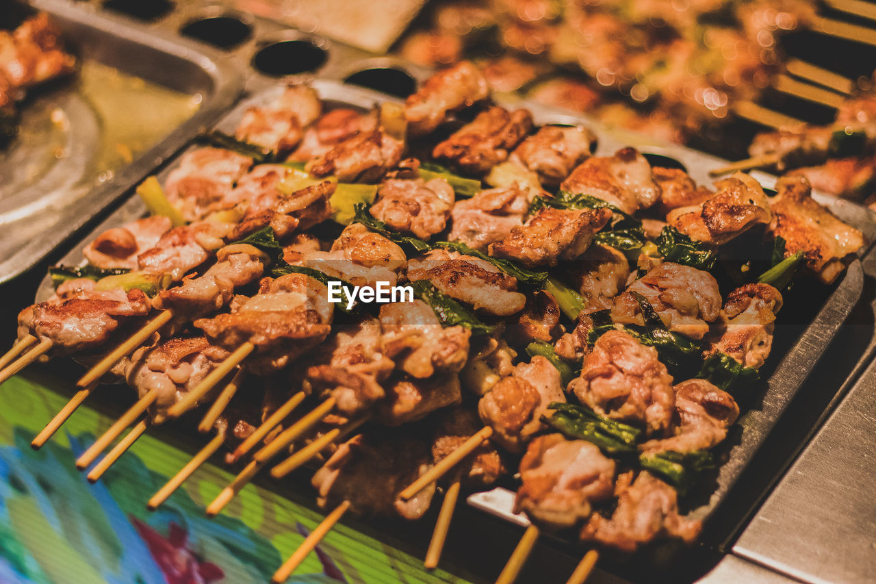 Close-up of grilled meat on skewers