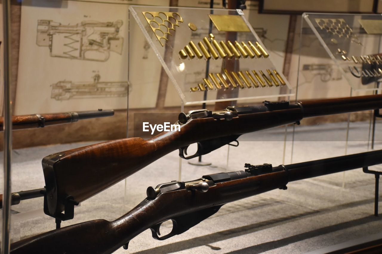 Close-up of rifles and bullets in museum