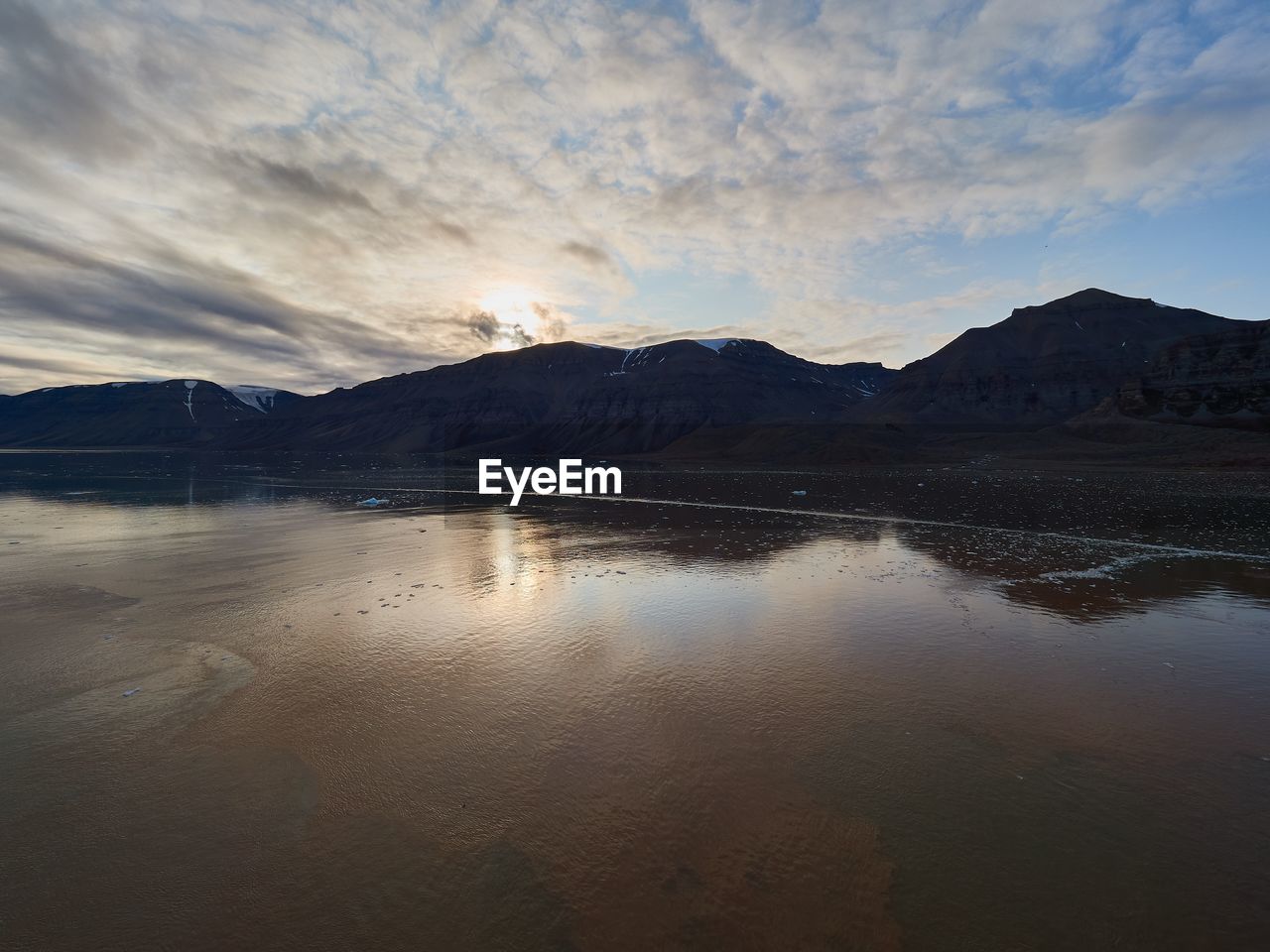 REFLECTION OF MOUNTAIN IN LAKE