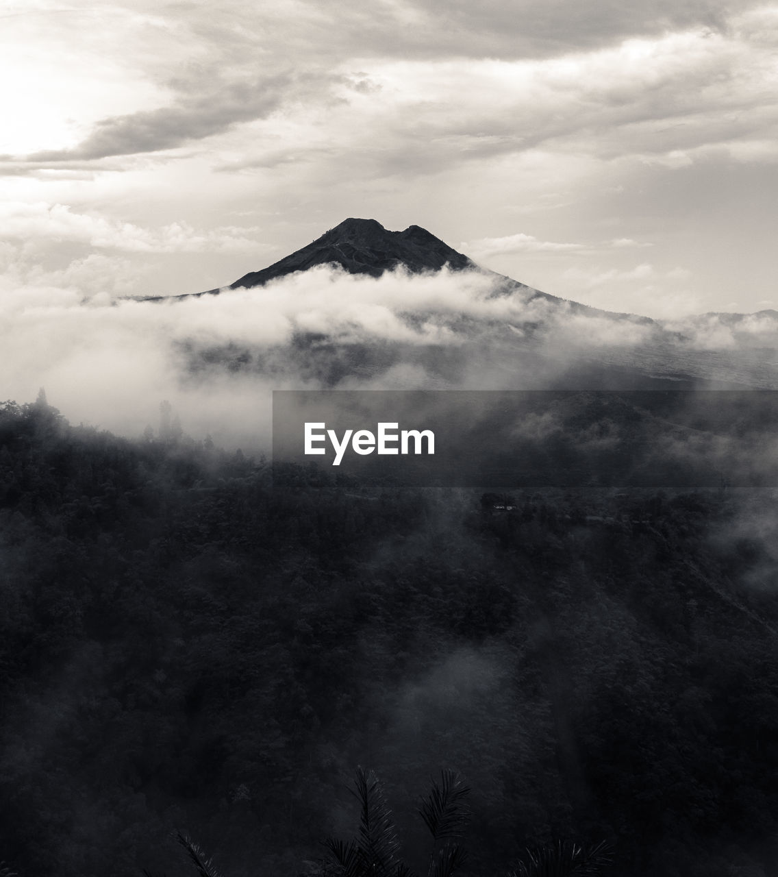 AERIAL VIEW OF VOLCANIC MOUNTAIN AGAINST SKY