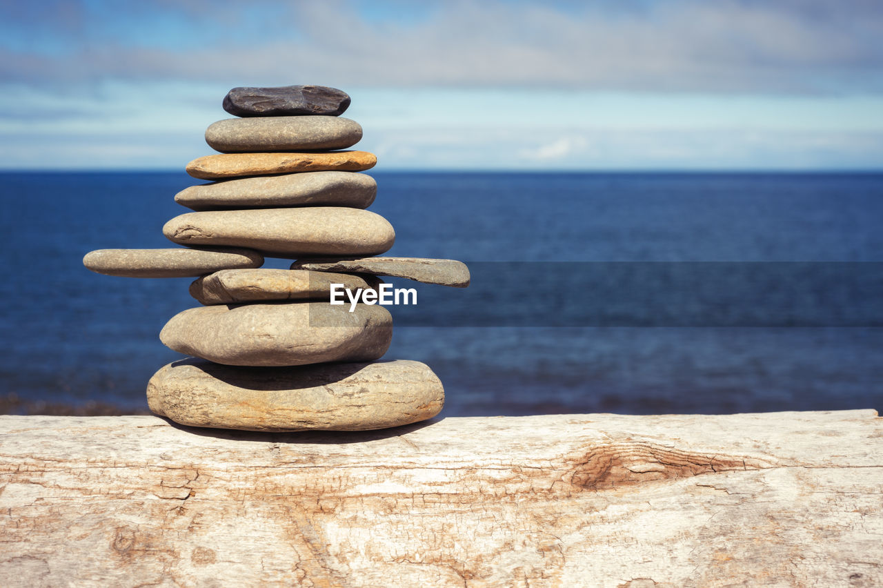 STACK OF PEBBLES ON SHORE