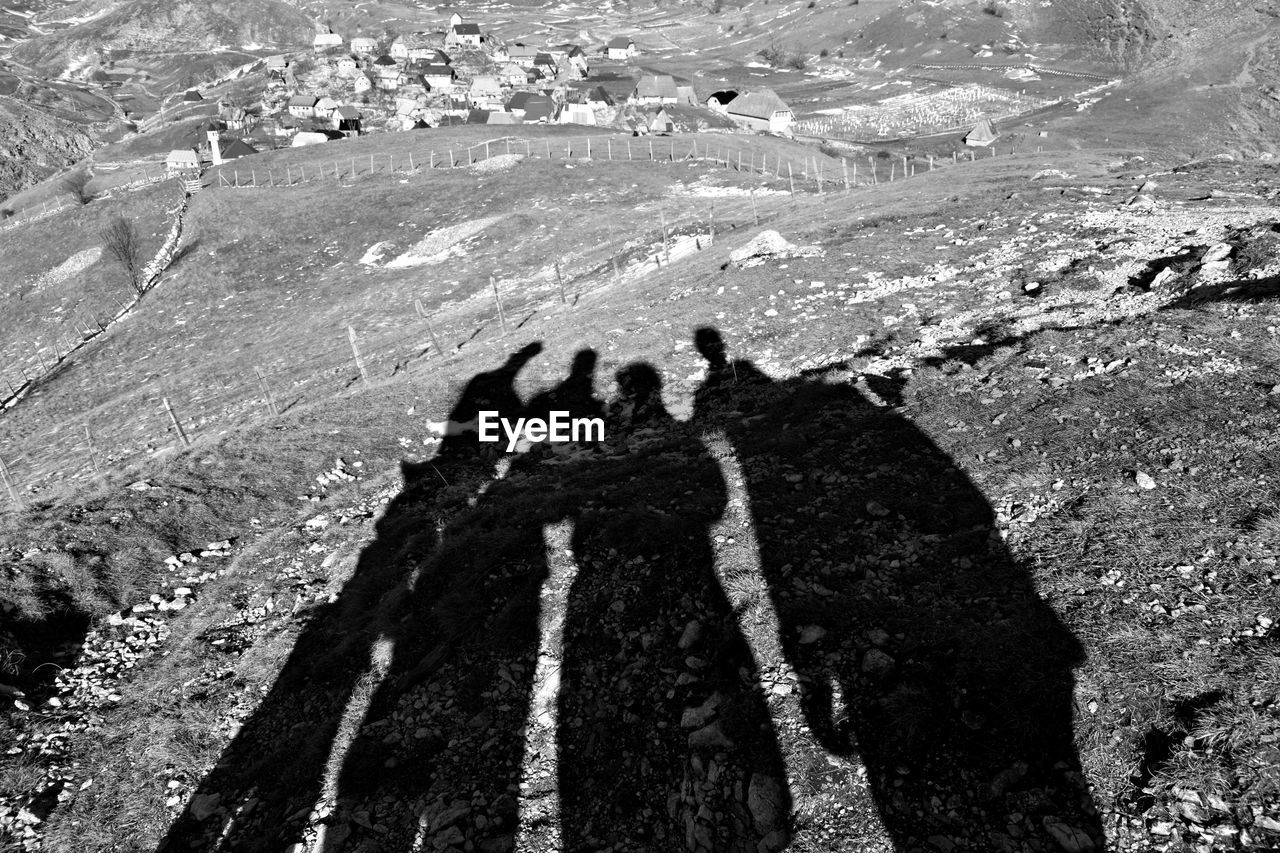 Shadow of people on landscape