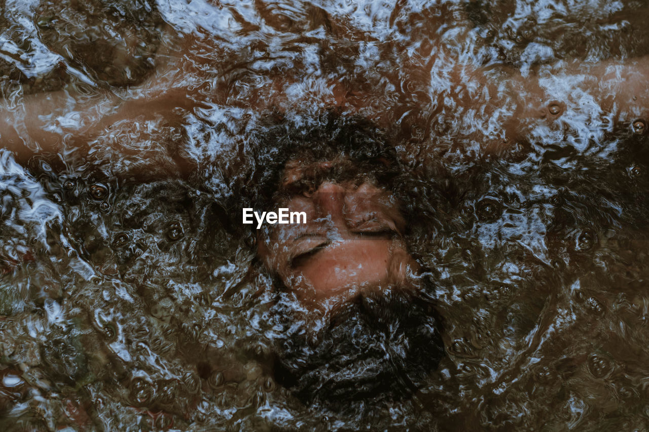 Portrait of woman swimming in water