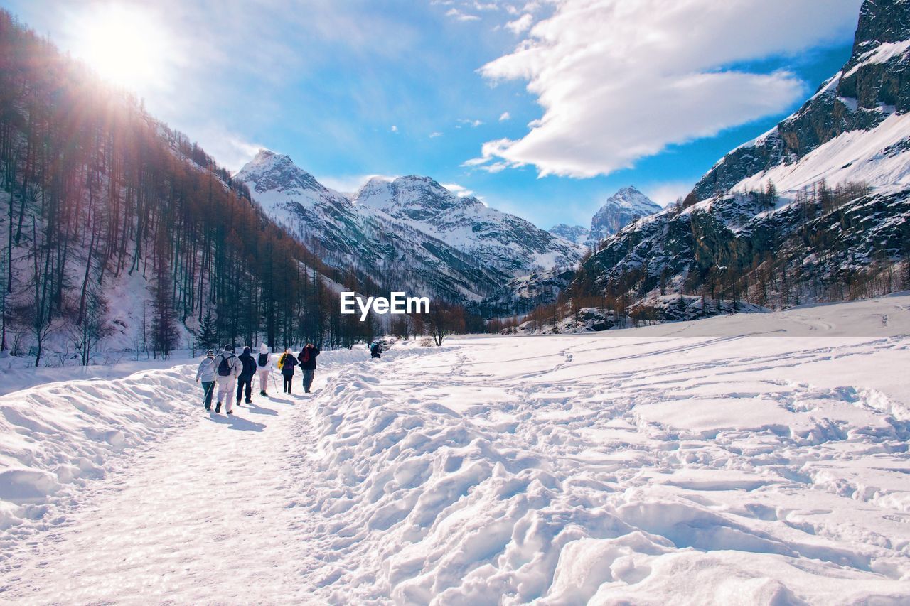 Scenic view of snow covered mountains against sky