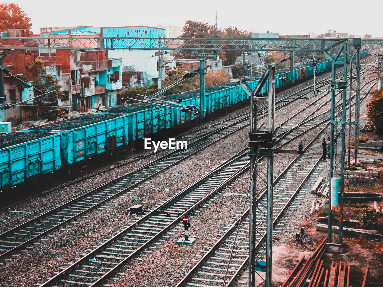TRAIN ON RAILROAD TRACKS AGAINST CLEAR SKY
