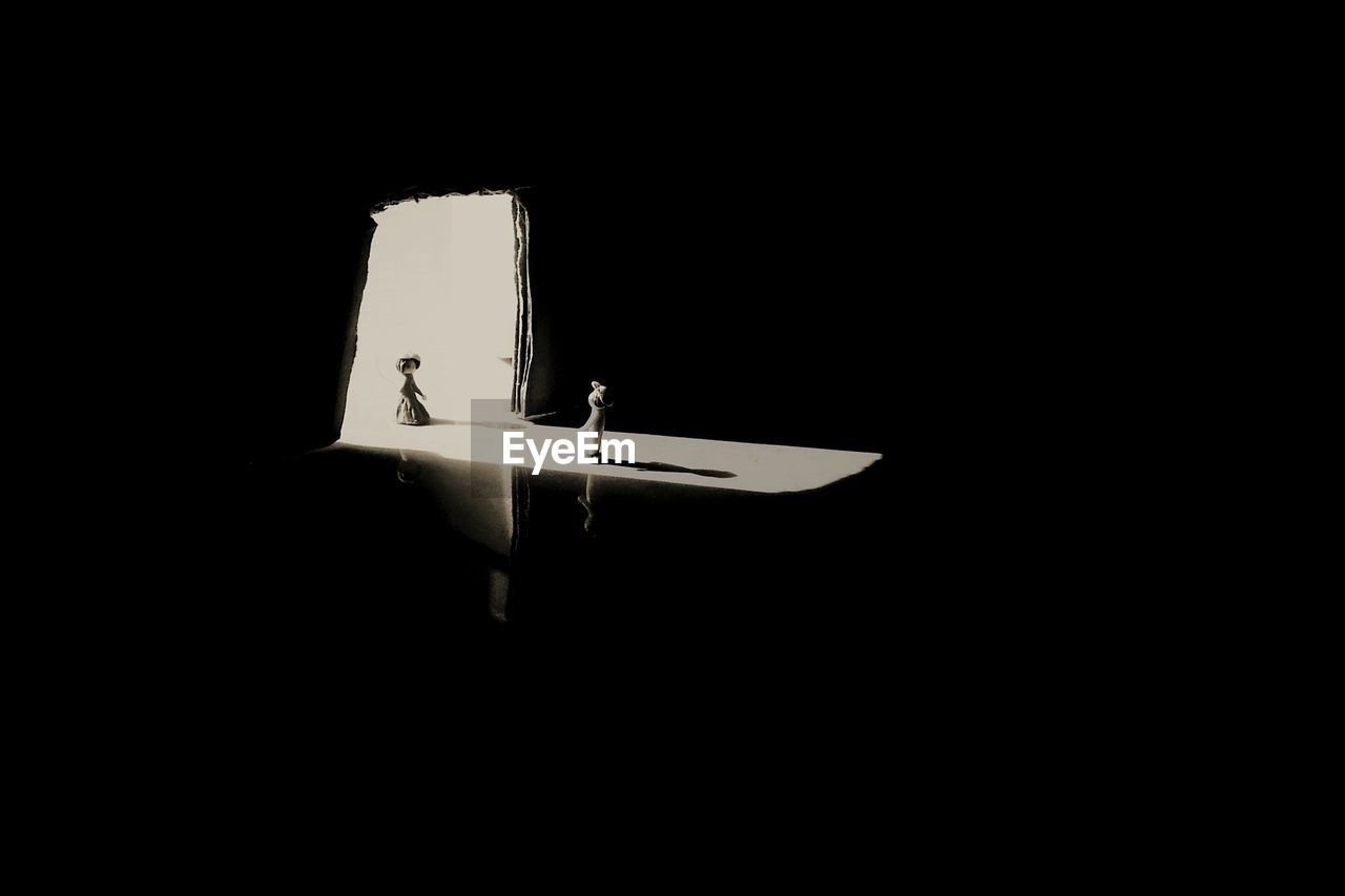 VIEW OF AIRPLANE IN ILLUMINATED NIGHT