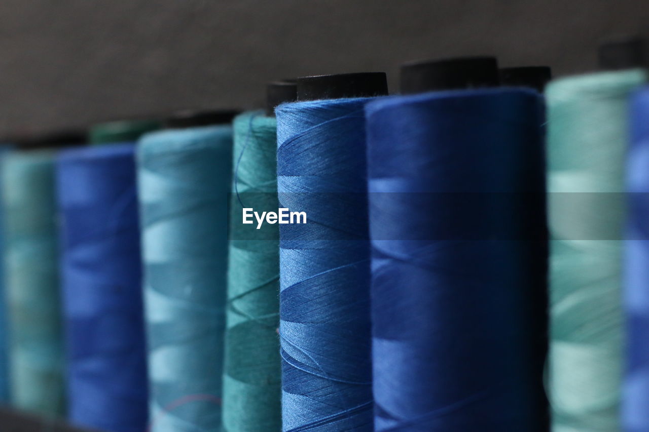 Blue thread. sewing thread.