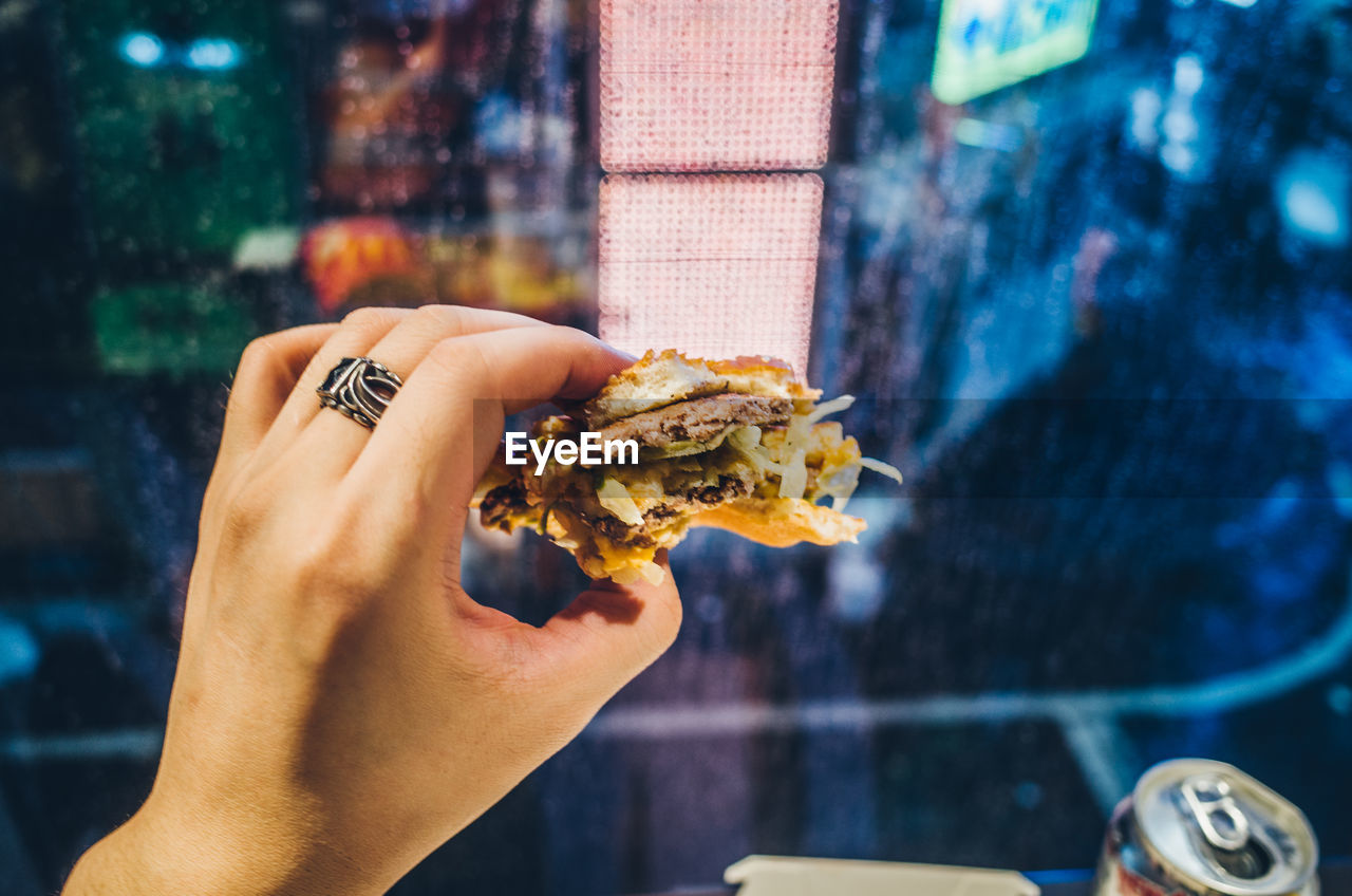 Close-up of hand holding sandwich