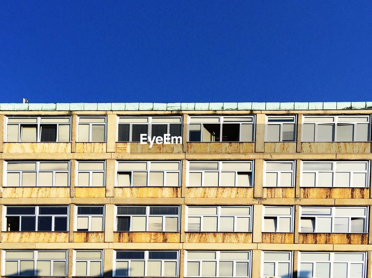 Old building against clear blue sky