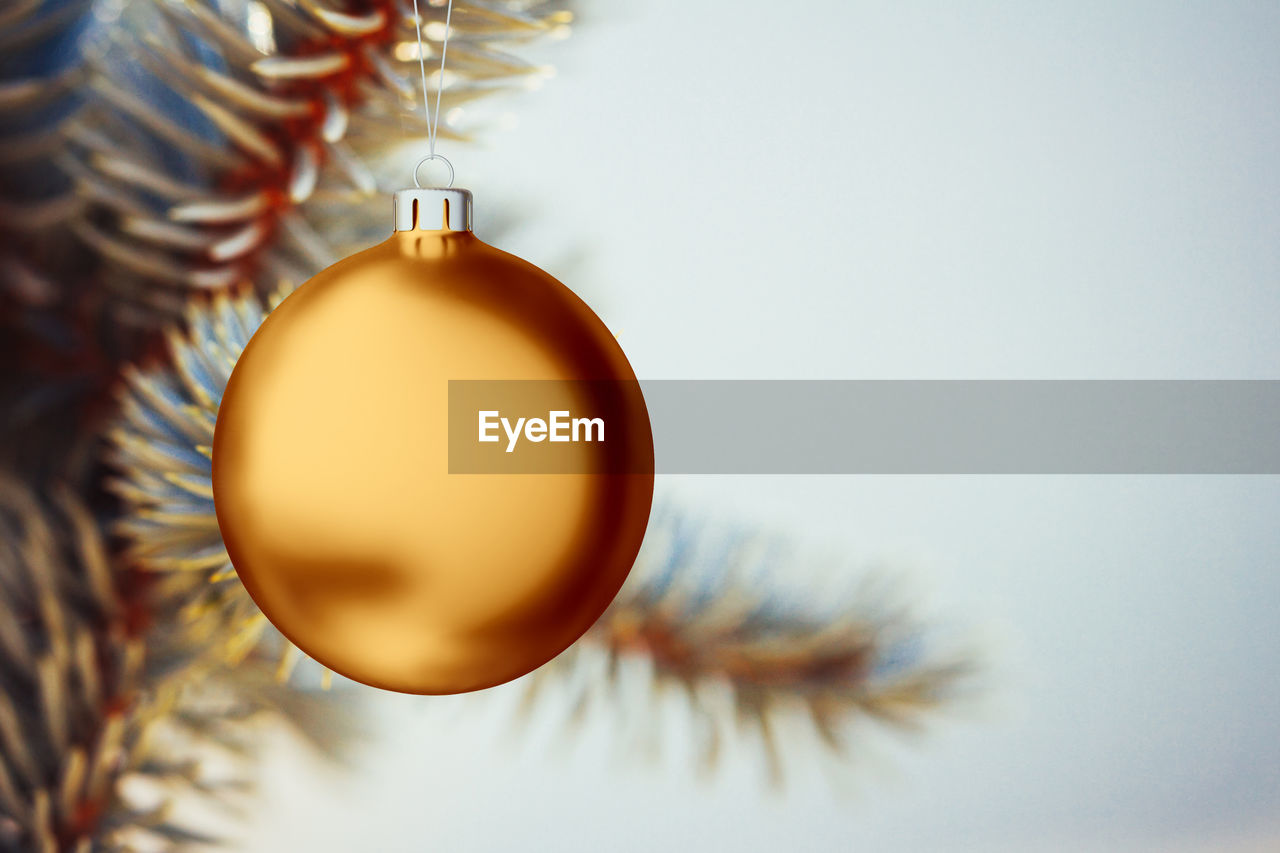 Christmas ball mockup isolated and hanging from the christmas tree