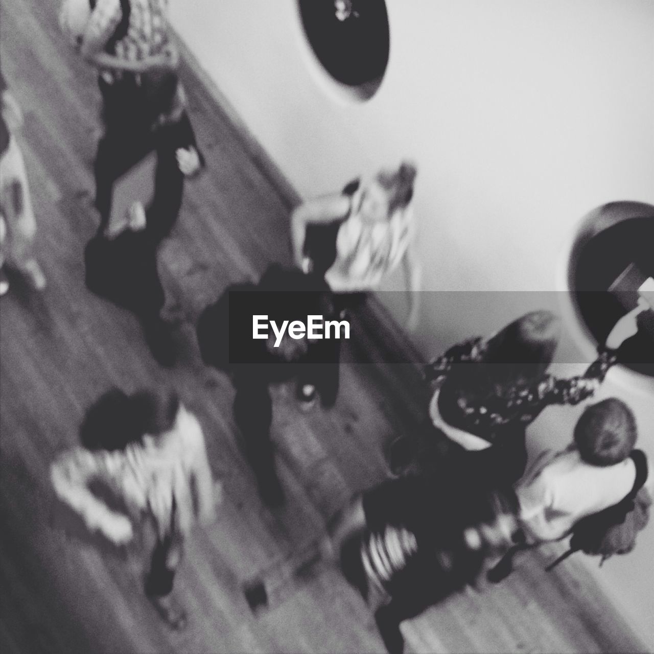 Overhead view of blurred people walking indoors