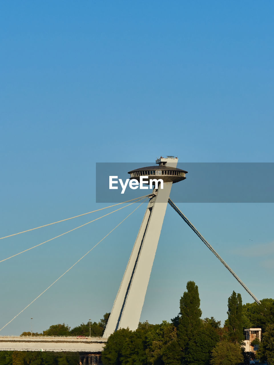 sky, nature, architecture, blue, technology, clear sky, built structure, tree, day, copy space, plant, transportation, tower, outdoors, low angle view, no people, travel, cable