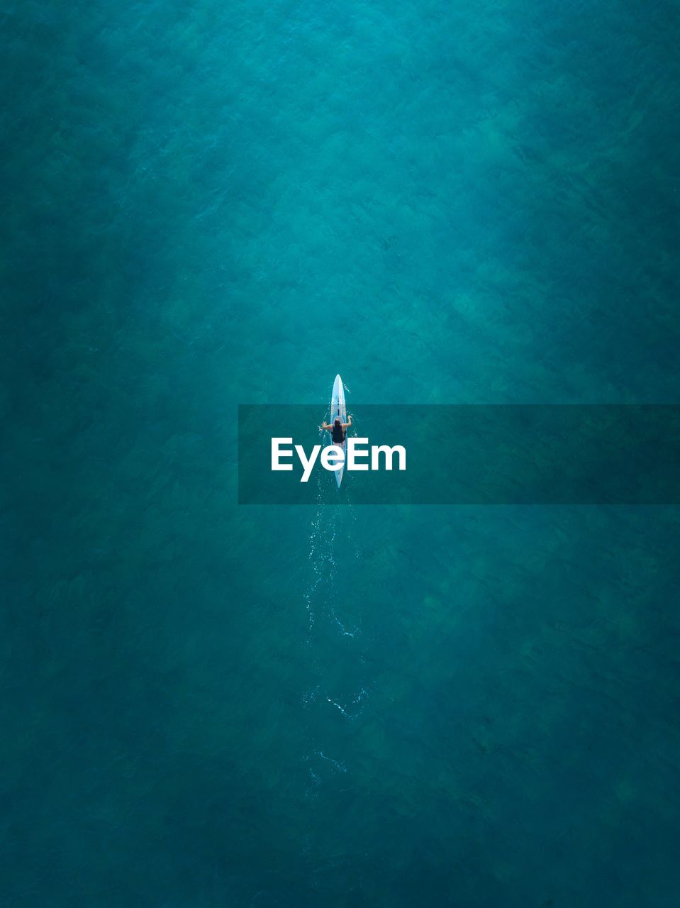 Aerial view of man kayaking in sea