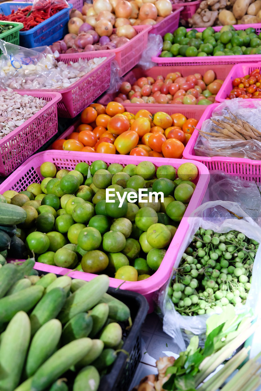 HIGH ANGLE VIEW OF FRUITS FOR SALE IN MARKET STALL