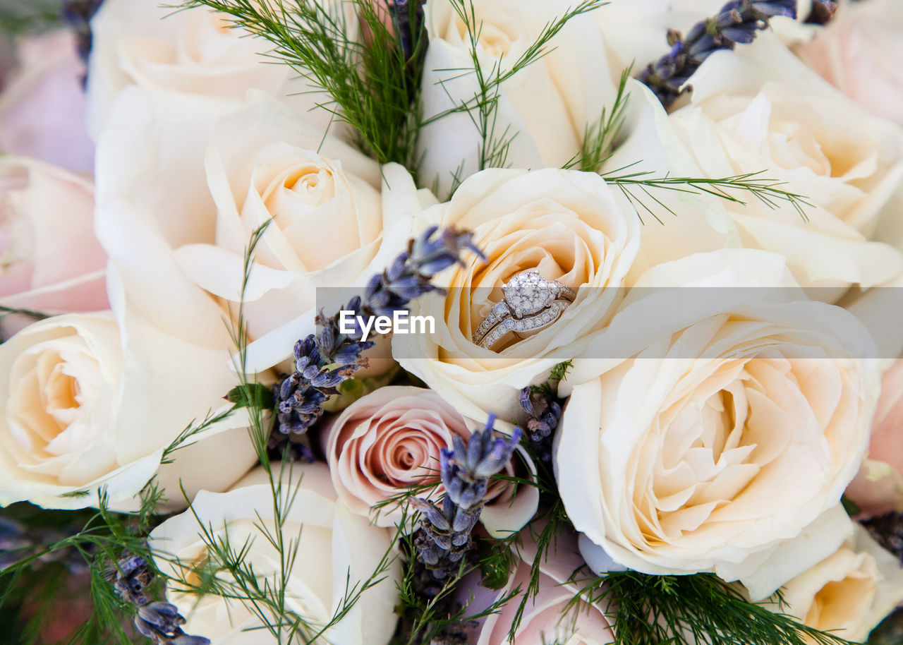 Close-up of flower bouquet with wedding ring